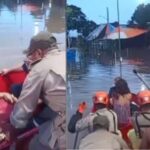 Grávida em trabalho de parto é resgatada em bote de área alagada no RJ Grávida em trabalho de parto é resgatada em bote de área alagada no RJ