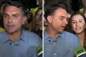 Esposa de Flávio Bolsonaro faz pergunta inusitada ao vivo na TV e leva 'bronca': 'Calma'